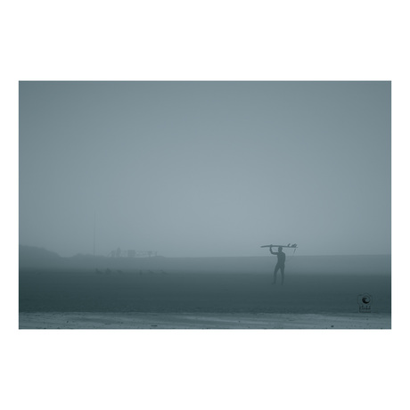 Surfer in the mist