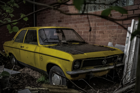 Abandoned car in yellow and black