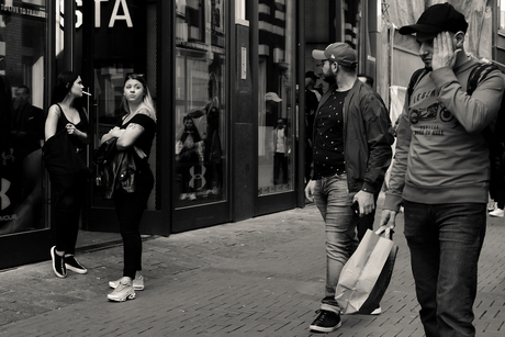 Exchanging glances on the Nieuwendijk, Amsterdam.