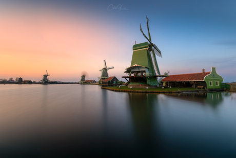 Majestic windmills at sunset