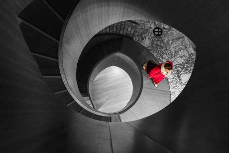 In a world of grey, a lady in red finds her way