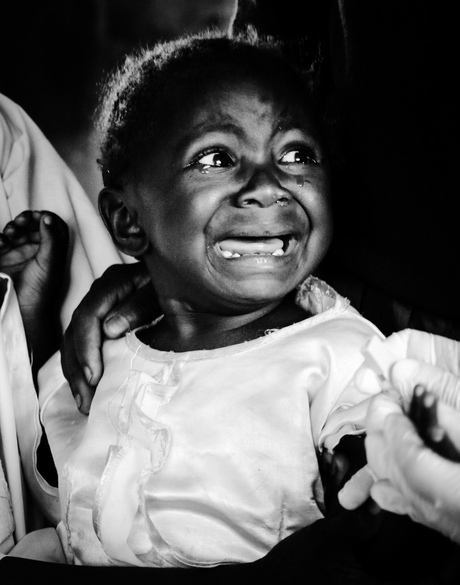 Scared girl at medical checks (for children) in Kenya 2015