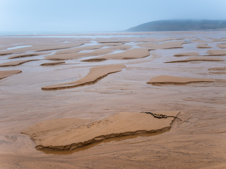 Zandsculptuur van moeder natuur