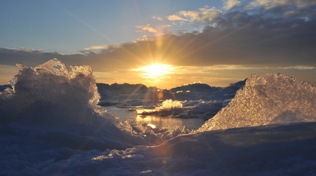 Sunset at frozen lake