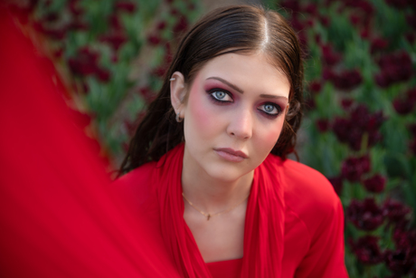 She blooms in crimson grace