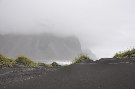 misty black beach