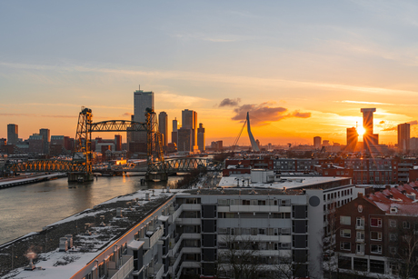 Golden hour in a snowcovered Rotterdam