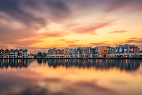 Rainbow houses at sunset