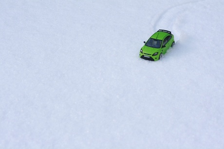 The ultimate green car in the snow