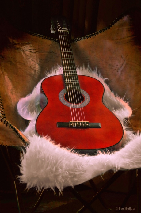 Klassieke gitaar op vlinderstoel