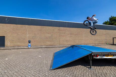 BMX-er Bruno Colautti jumping high in the sky