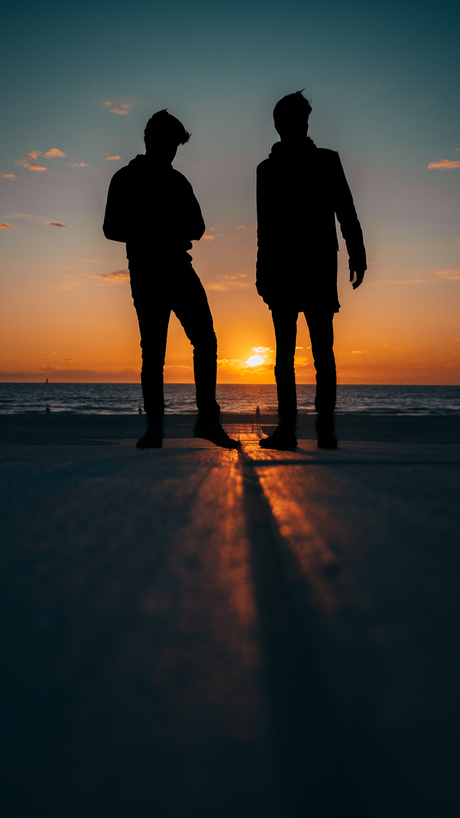 Silhouettes aan het Strand