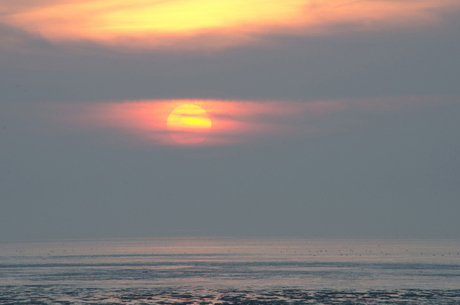 zonsondergang bij het wad