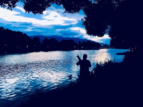 Fishing blue sunset