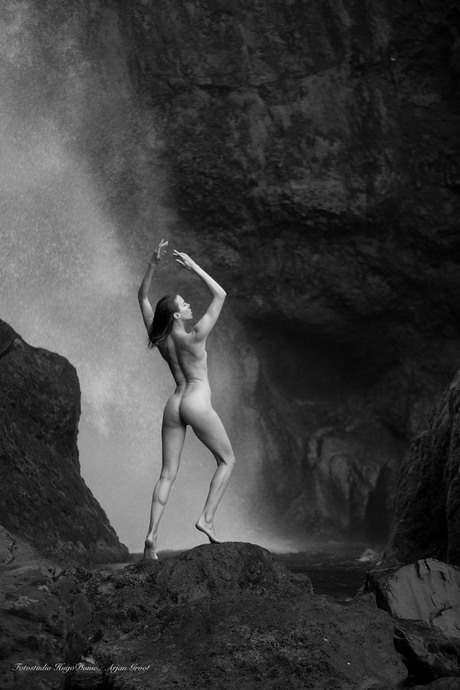 Nude in front of the waterfall