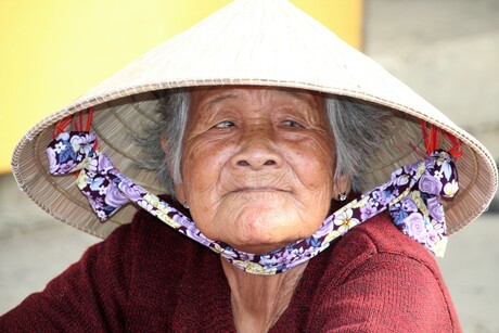 Old lady on the market in Vietnam