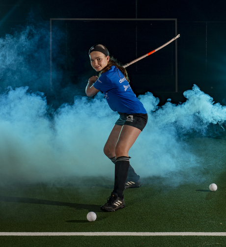 Fotoshoot hockey gekleurde lichten en rook. 