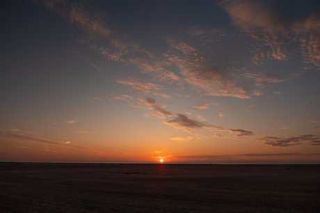 Zonsondergang aan Strand