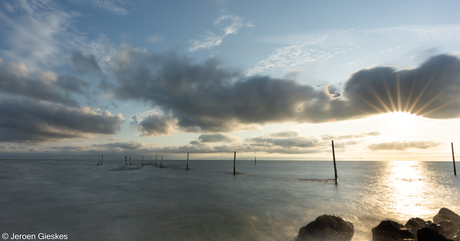 Visnetten met zonsopkomst