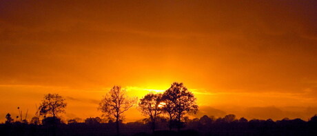 Zonsondergang platteland