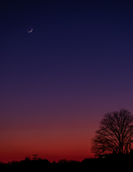Zonsondergang en maansikkel