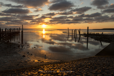 Zonsopkomst boven het wad.