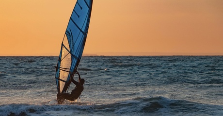 Surfing at sunset