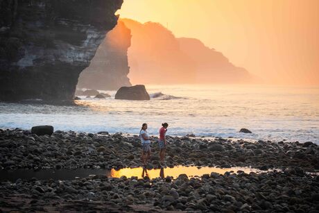 Mother and daughter in sunrise