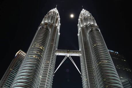 Hazy full moon between the Petronas Towers