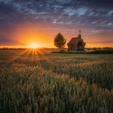 Sunset over the Kapel ope de Heuvel