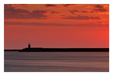 Zonsondergang met noordpier