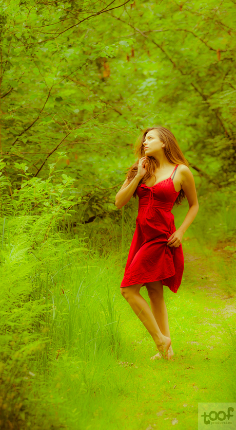 Red lady in green forest