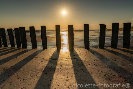 De Zeeuwse kust, zonsondergang