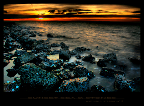 sunset sea stones