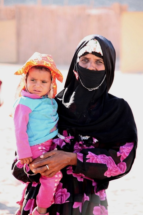 Woman with child in Sahara Desert