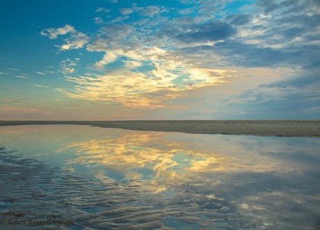 Reflection sky and sand