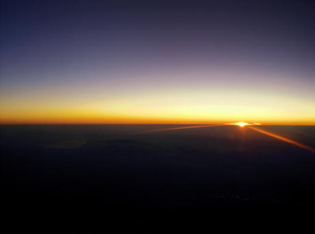 Zonsondergang uit vliegtuig