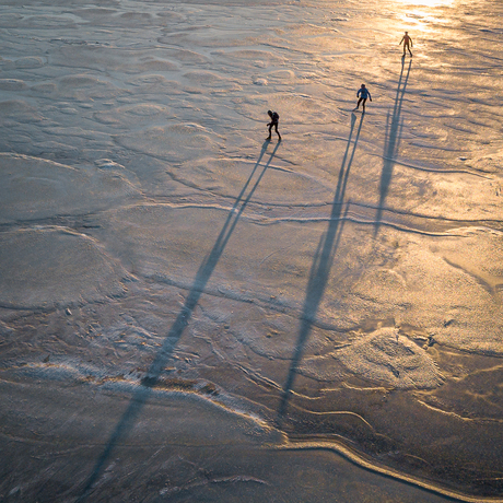 3 ice skaters