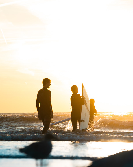 Surfing at golden hour