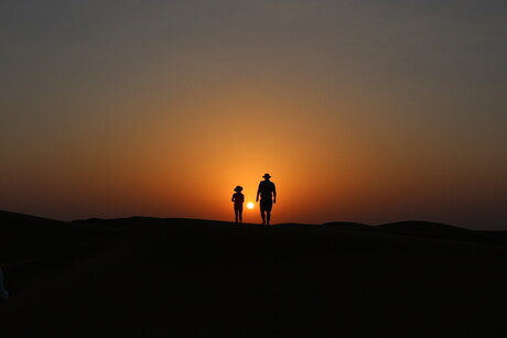 Desert sunset - father & daughter