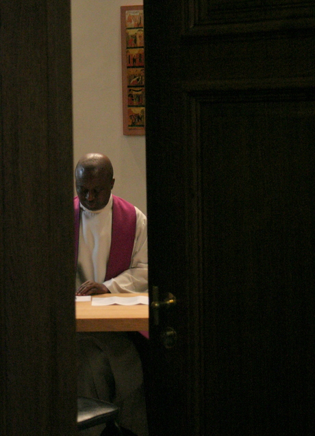 Priest at work