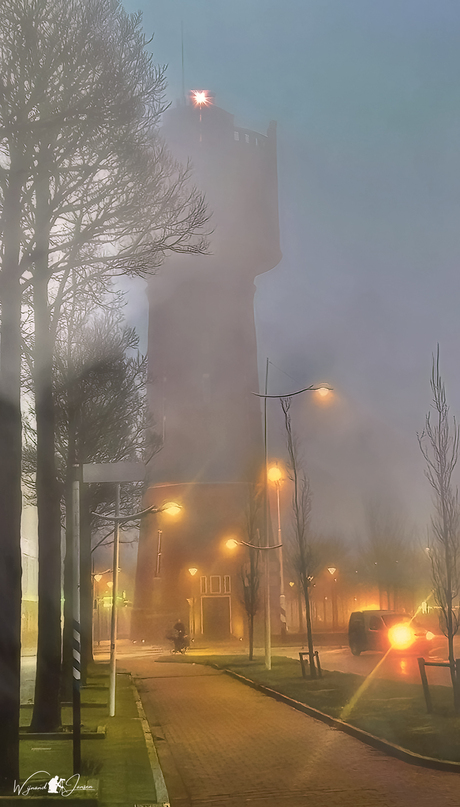 Water tower in the mist