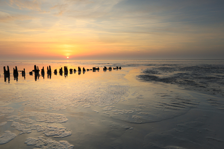 Zonsondergang aan het wad