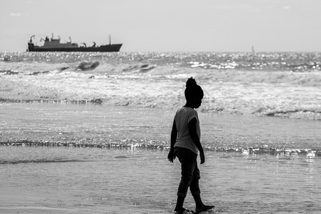 Silhouette of a child at a beach