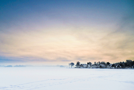 Small village on a frozen lake