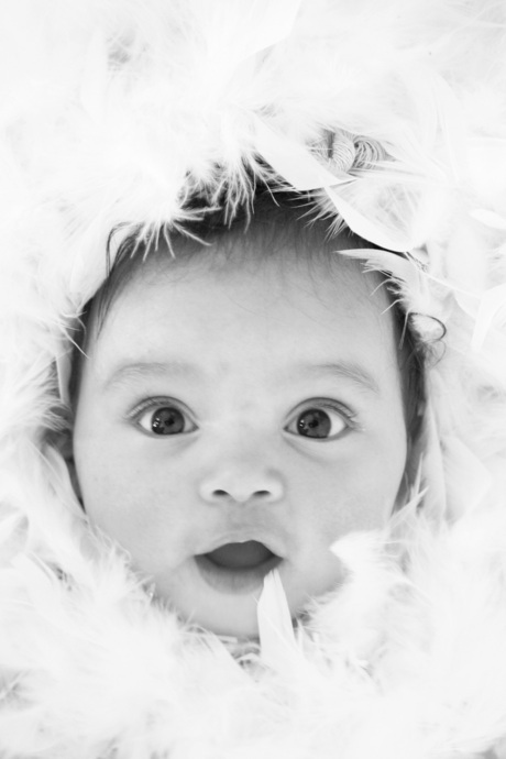 Baby in feathers..