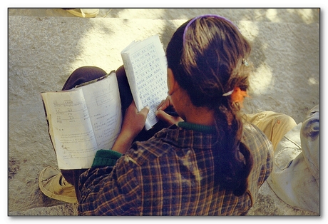 LHASA POTALA PALACE STAIRS PUPIL DOING HER HOMEWORK