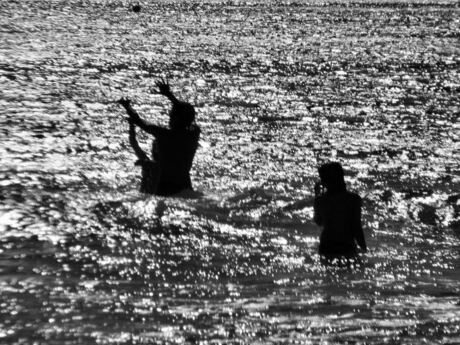 Children playing in sea