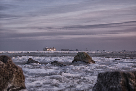 Ferry on the ice in the evening