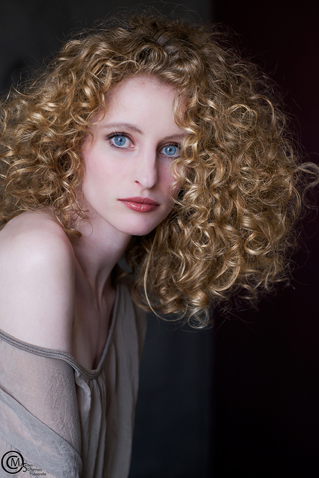 The girl with the curly hair